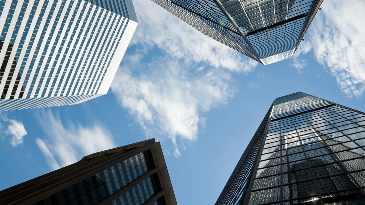 Four skyscrapers from below; stock photo wide angle view towards high rises in downtown Denver