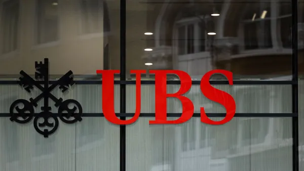 A close-up of the UBS logo on a window.