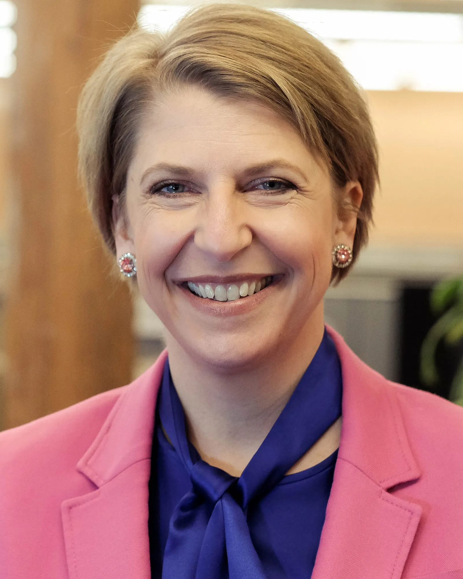 A person is looking at the camera. Their head and shoulders are seen.