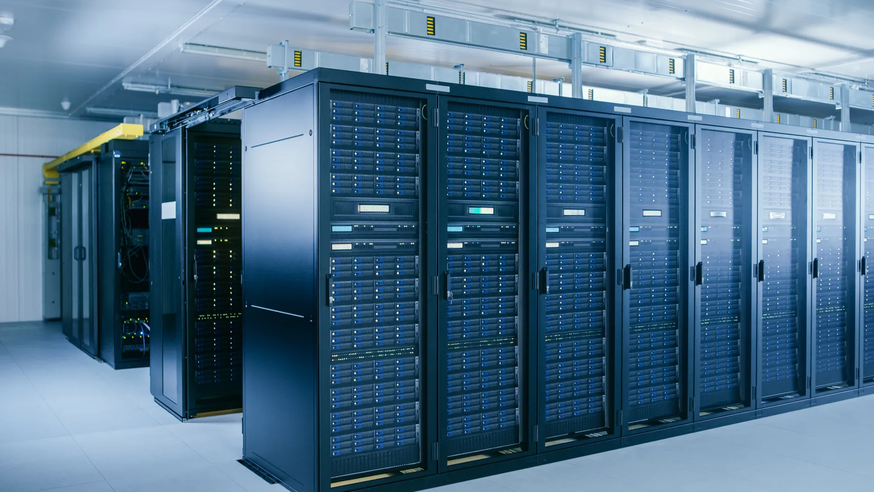 Image of Data Center With Multiple Rows of Fully Operational Server Racks.