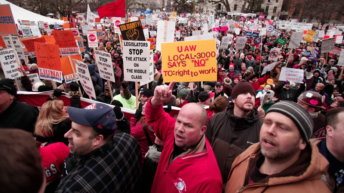 Union members protest in Lansing, Michigan in 2012 over right-to-work legislation