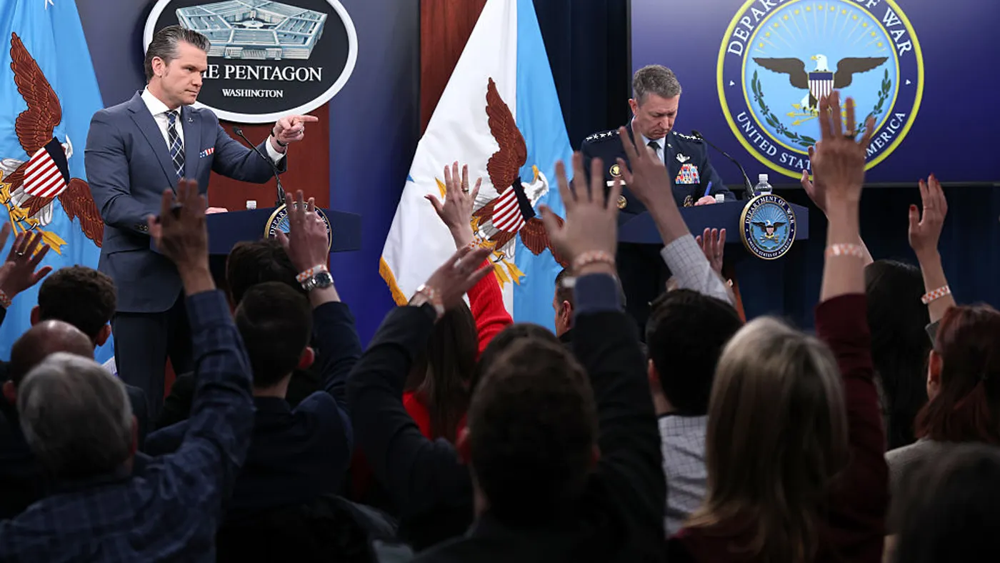 Secretary of War Pete Hegseth and Chairman of the Joint Chiefs of Staff Air Force General Dan Caine (R) provide updates on the continued military operations on Iran during a press briefing on the Iran war at the Pentagon on March 19, 2026 in Arlington, Virginia. Iran-backed threat actors have targeted U.S. critical infrastructure sites in recent since the launch of the war.