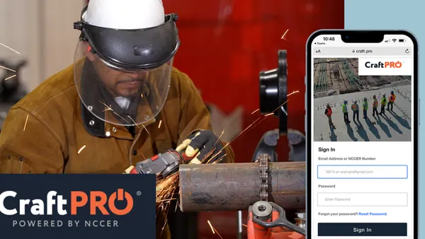 A construction worker using an application on a phone.