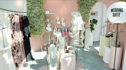 The Wedding Suite in a Showfields store in Miami features dresses on the left, shoes in the center and on the right.