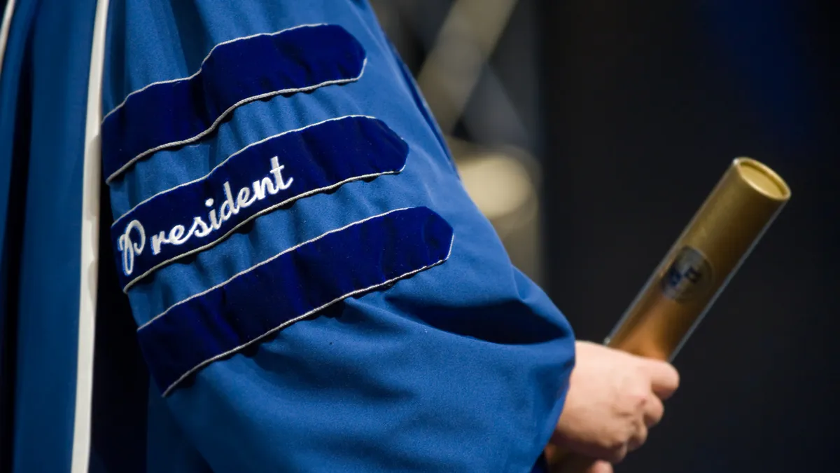 A cropped image shows a person in graduation regalia with the word "President" on it