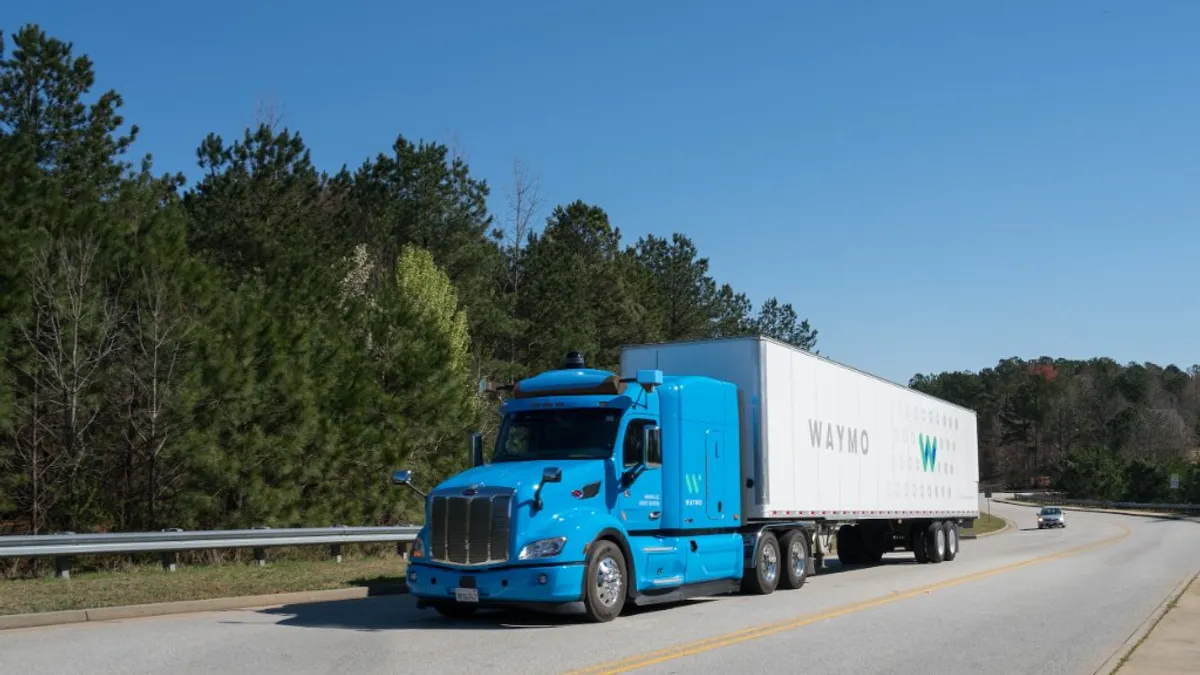 A waymo autonomous truck on the highway.