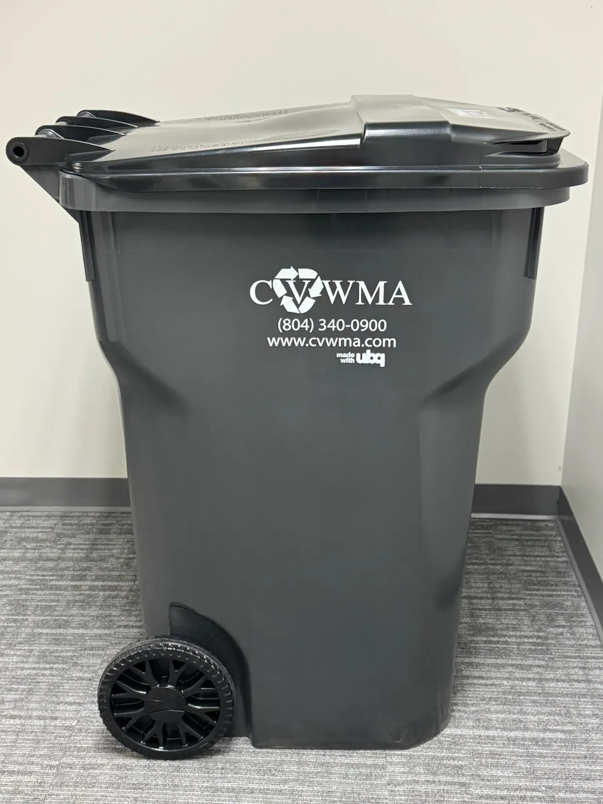 A grey waste cart