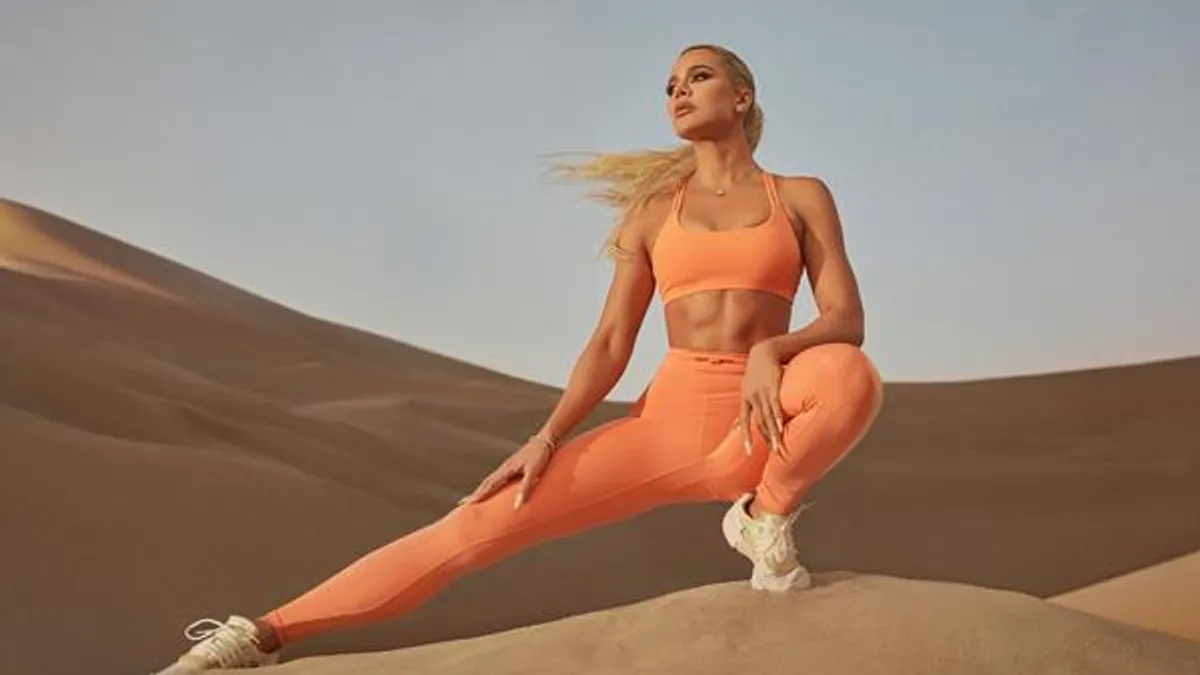 Khloe Kardashian wearing Fabletics clothing.