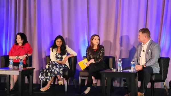 four panelists on stage