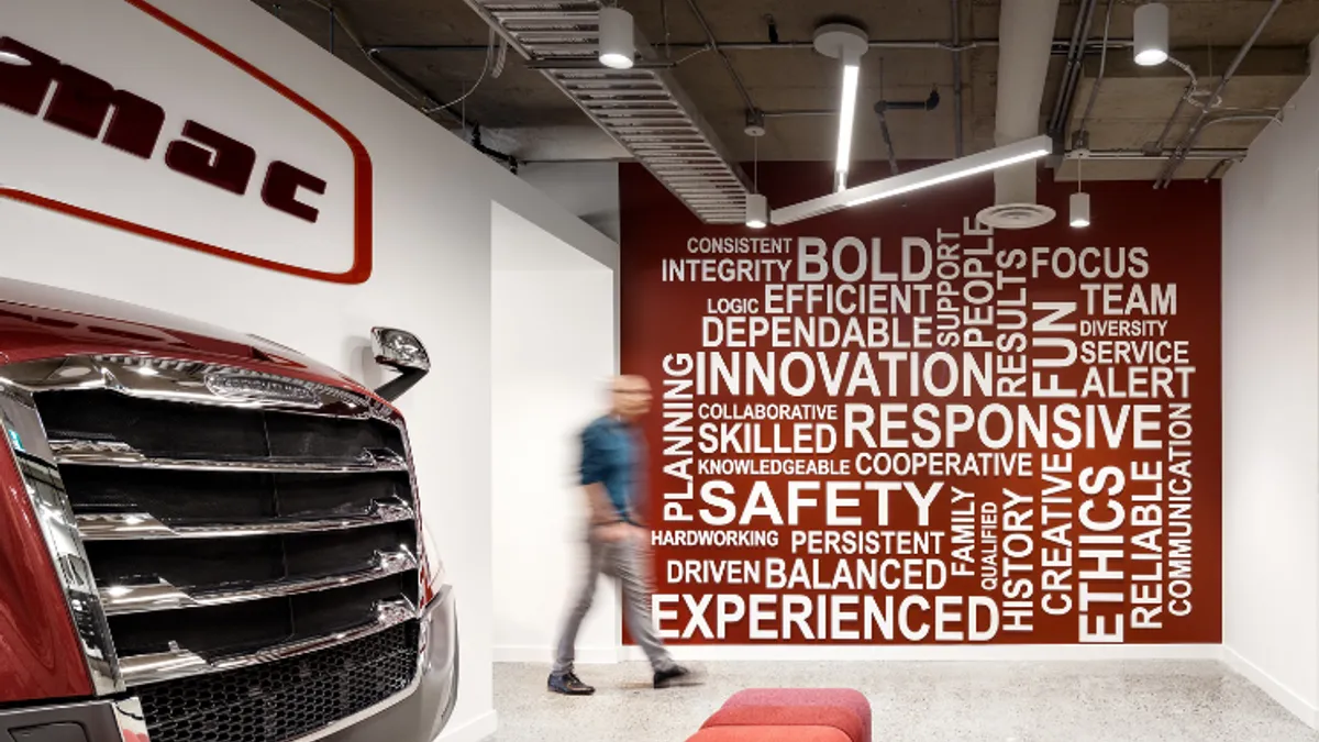 A Freightliner truck front and word art adorn walls at Trimac's headquarters.