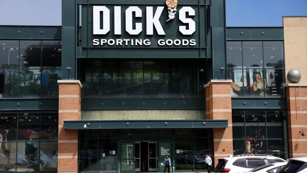 A sign is posted in front of a Dick's Sporting Goods store in Daly City, California.