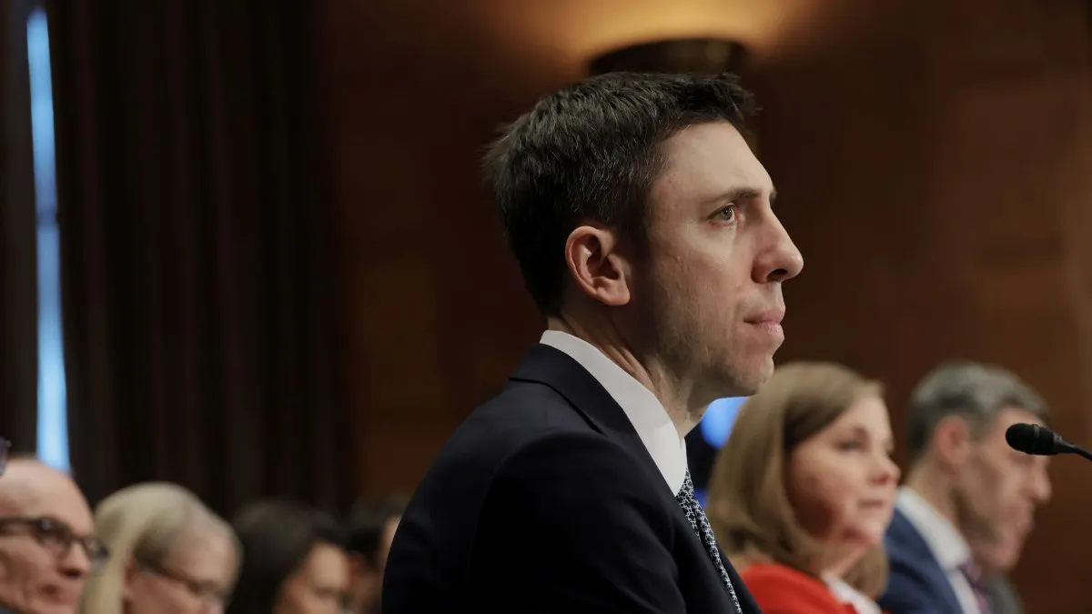 FDIC Chairman Travis Hill looks off during a Senate Banking Committee meeting.