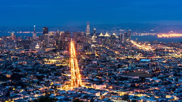 View of San Francisco from above. Long exposure at night. dramatic sky, lights and glitters