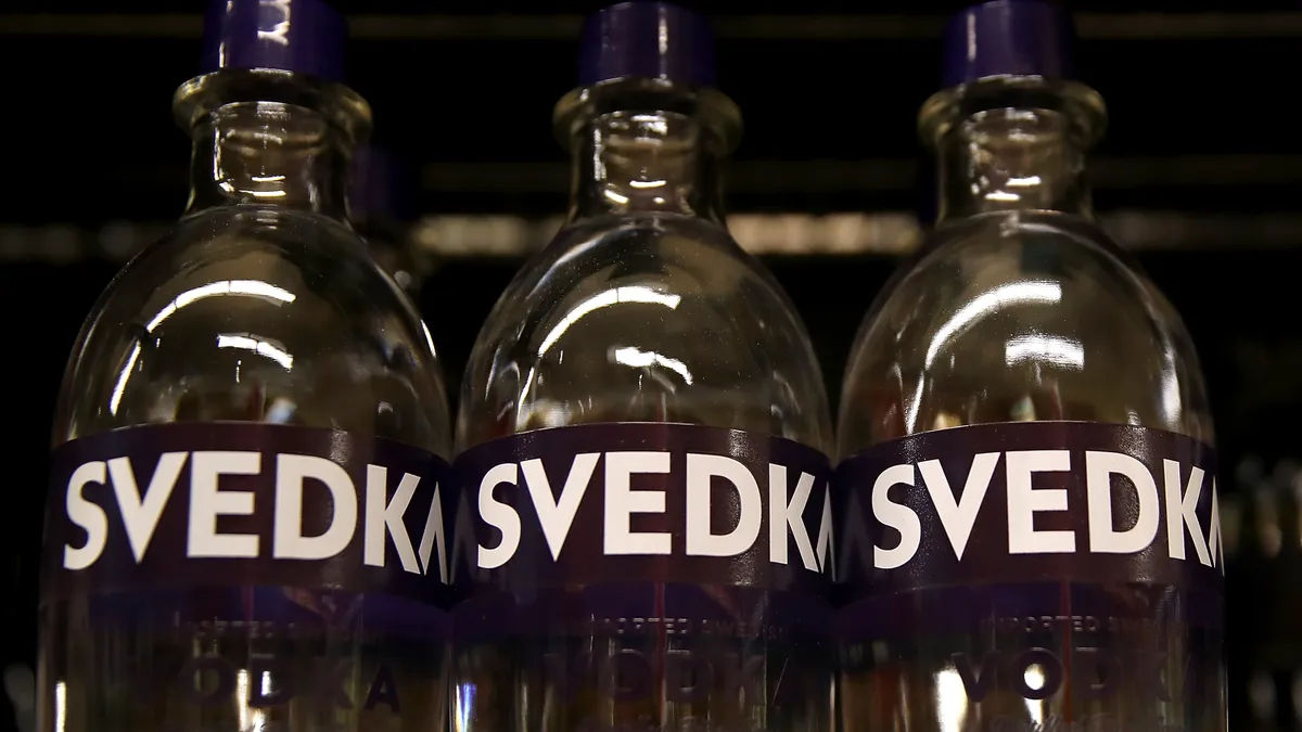 Glass bottles of Svedka vodka.