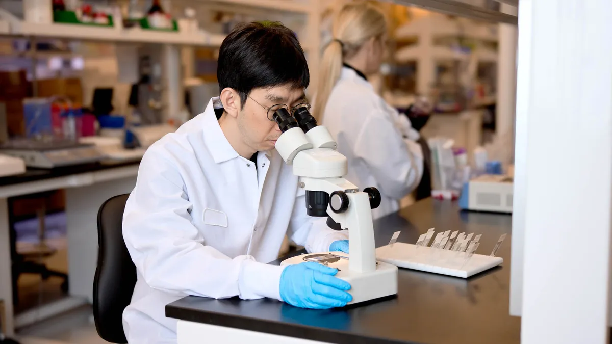 A person uses laboratory equipment in Endeavor Biosciences' offices.