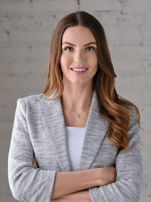 Headshot of a woman in business attire.