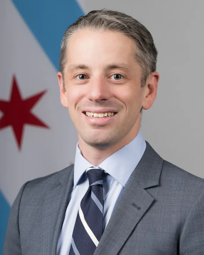 A headshot of Zach Baughman