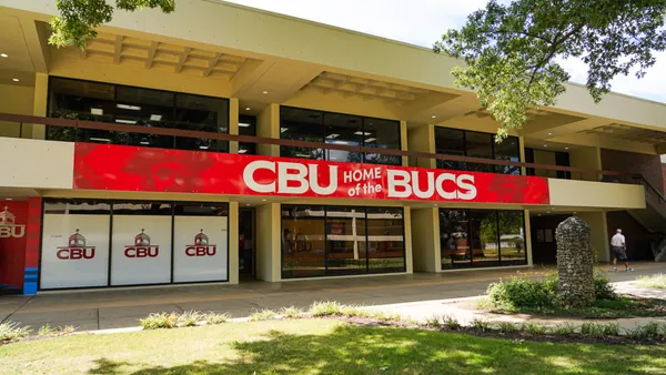 Campus building with exterior sign reading "CBU home of the BUCS."