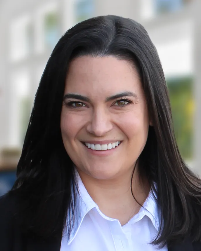 Headshot of a woman in business attire.