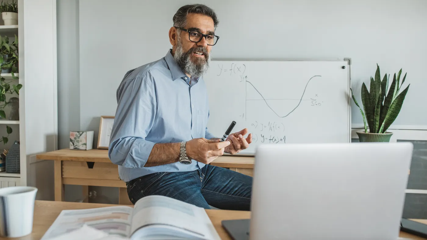 Professor teaching students remotely