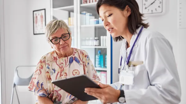 Doctor sharing medical results with woman