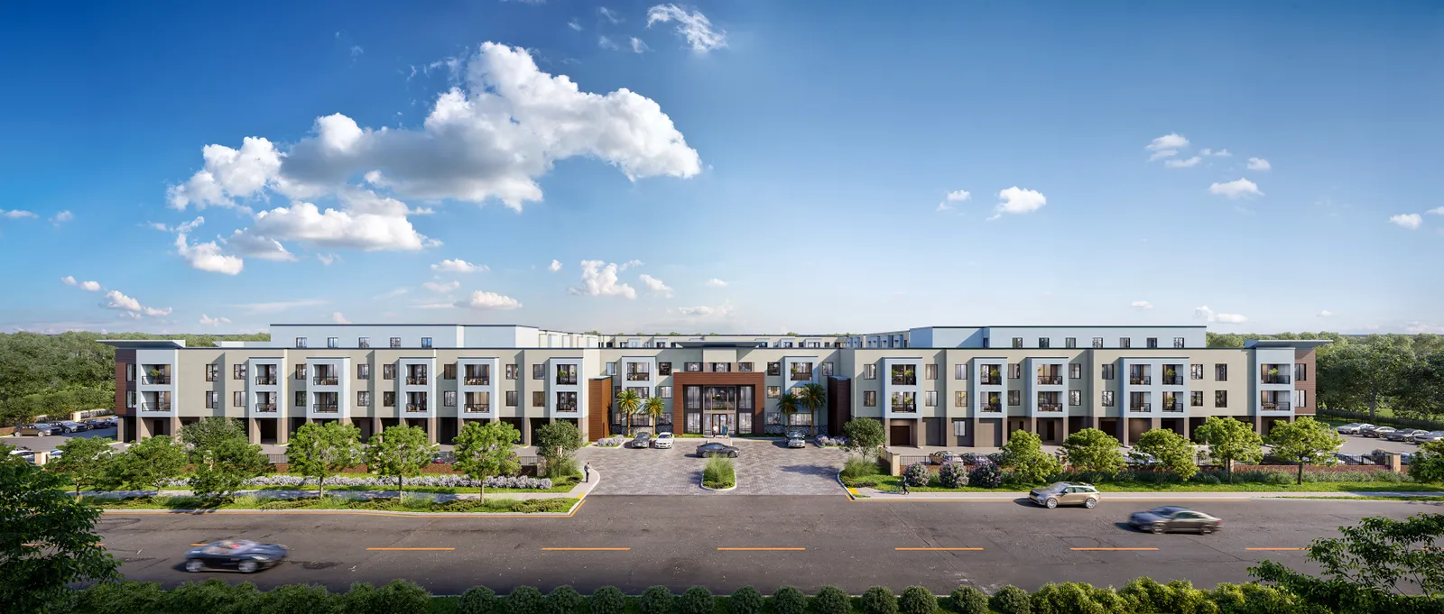 A four-story apartment complex with white paneling.