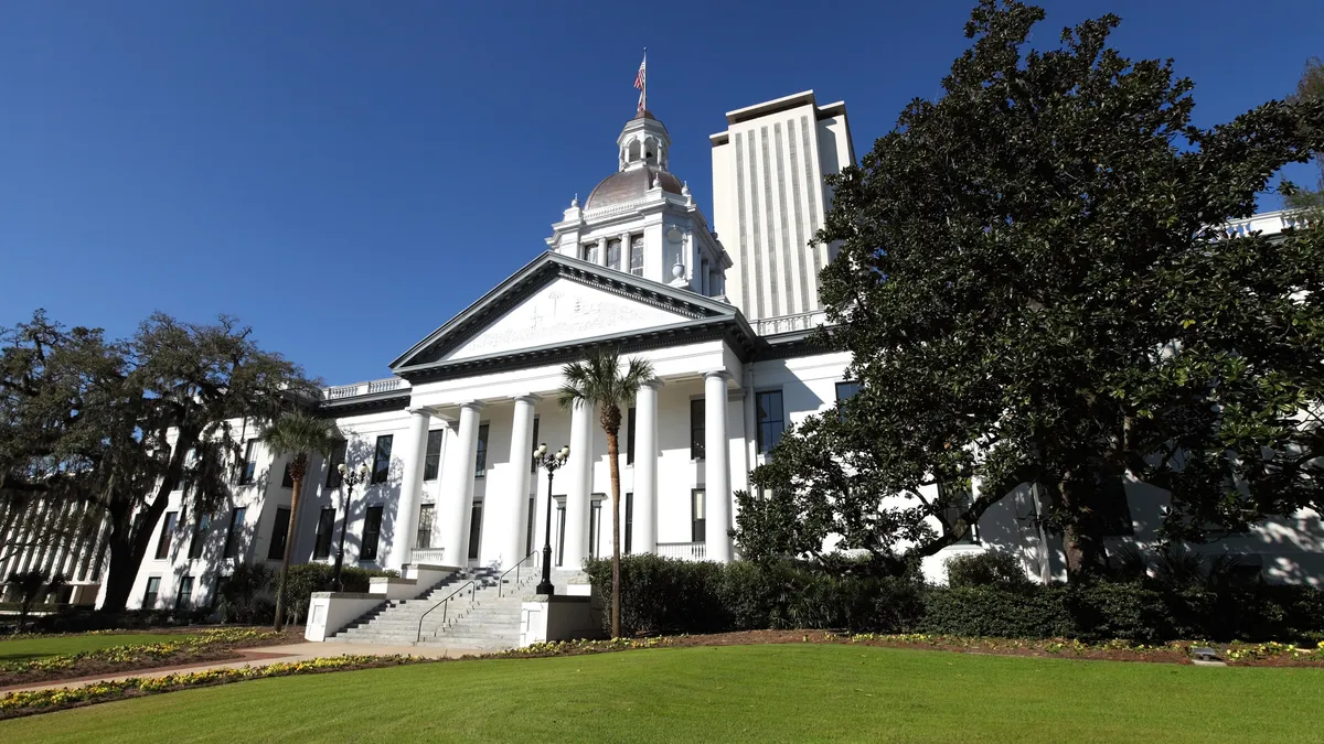 The Florida state capitol building, a white building with Roman columns.