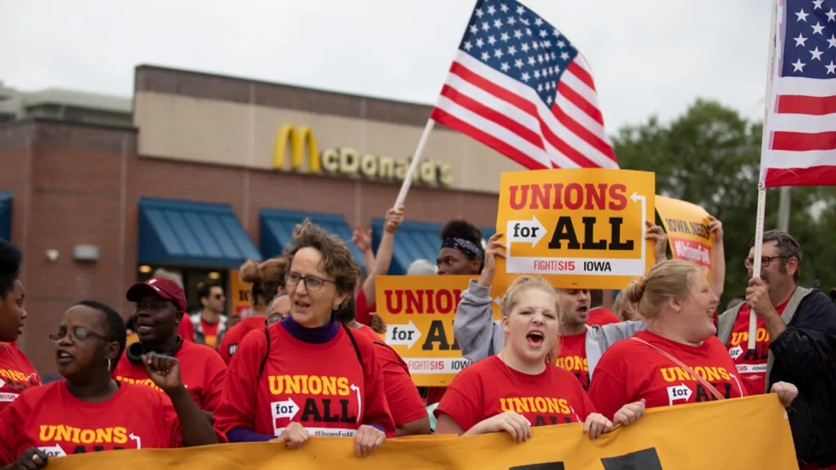 Mary Kay Henry with fast food workers at a strike line.