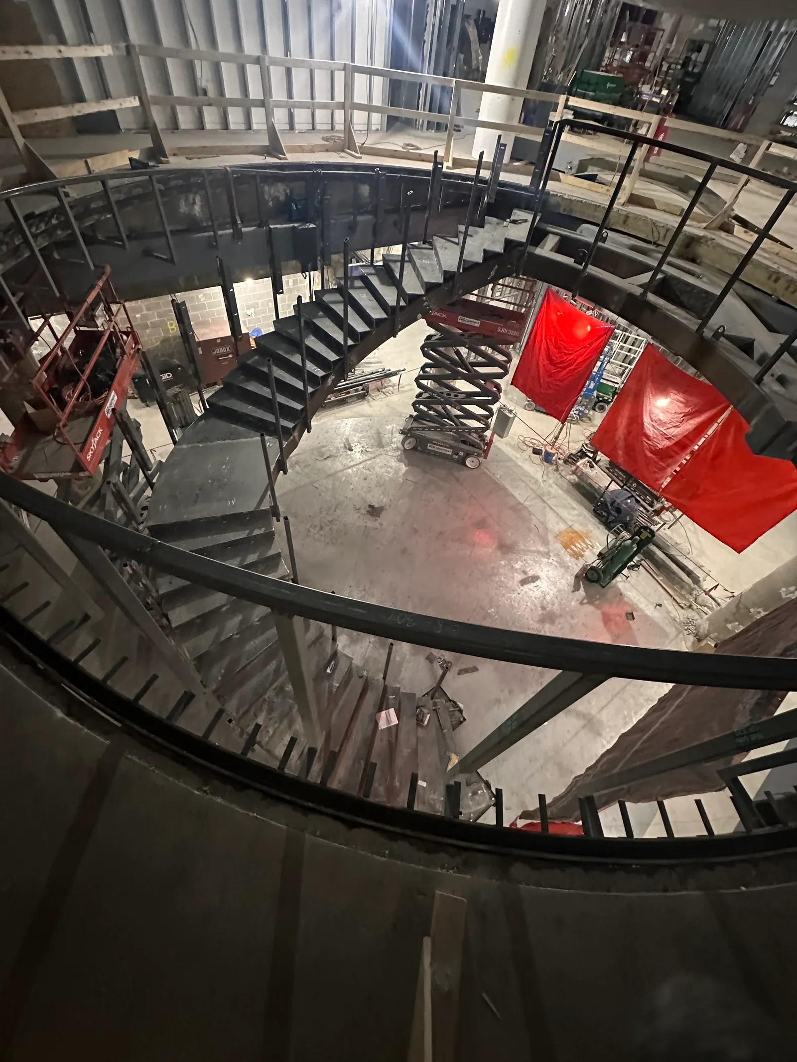 Construction crews work on the staircase at Museum of Exploration.
