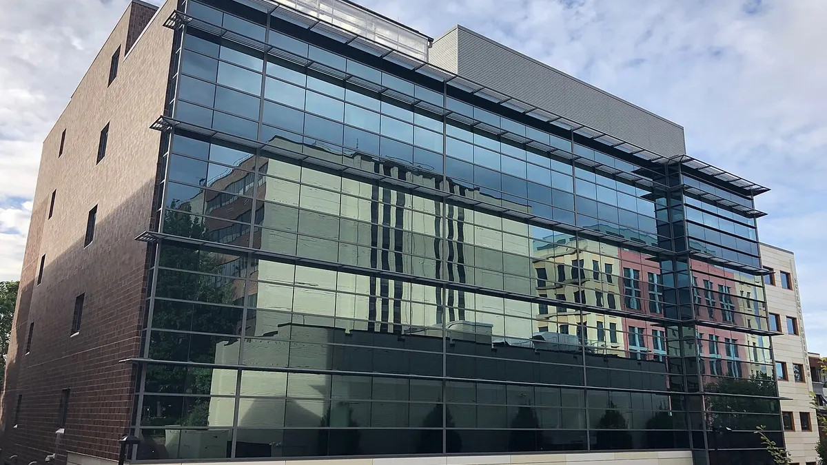 Building with glass front and brick sides.