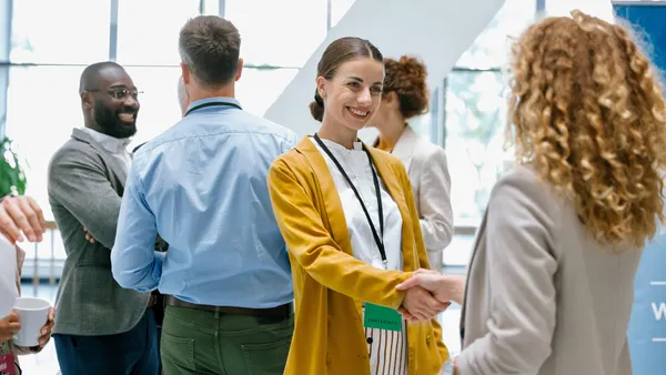 People networking at a conference.