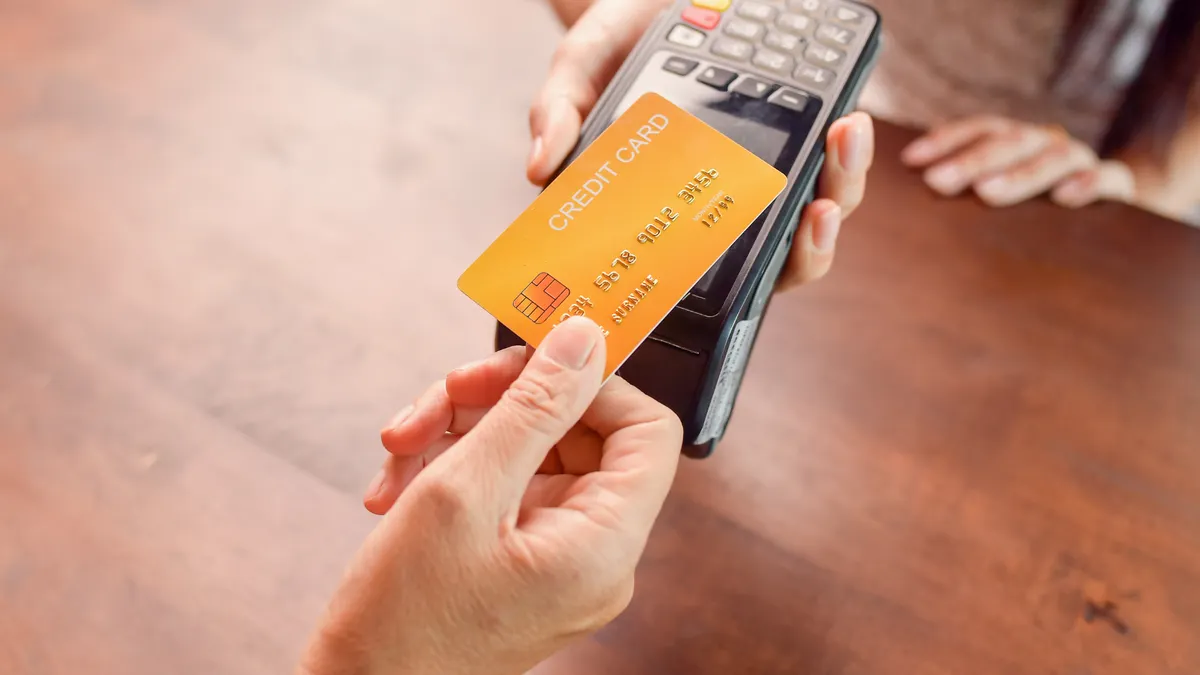 Moment of payment with a credit card through terminal.