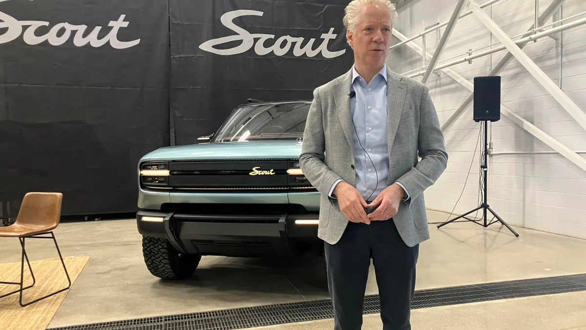 Scout Motors CEO with one of the VW brand's prototype electric trucks
