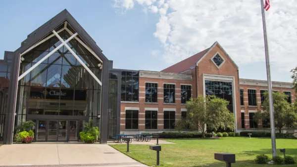 Brick front and glass modern university building.
