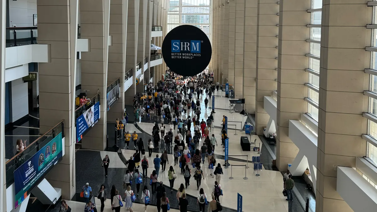 Individuals move through the SHRM24 conference hall