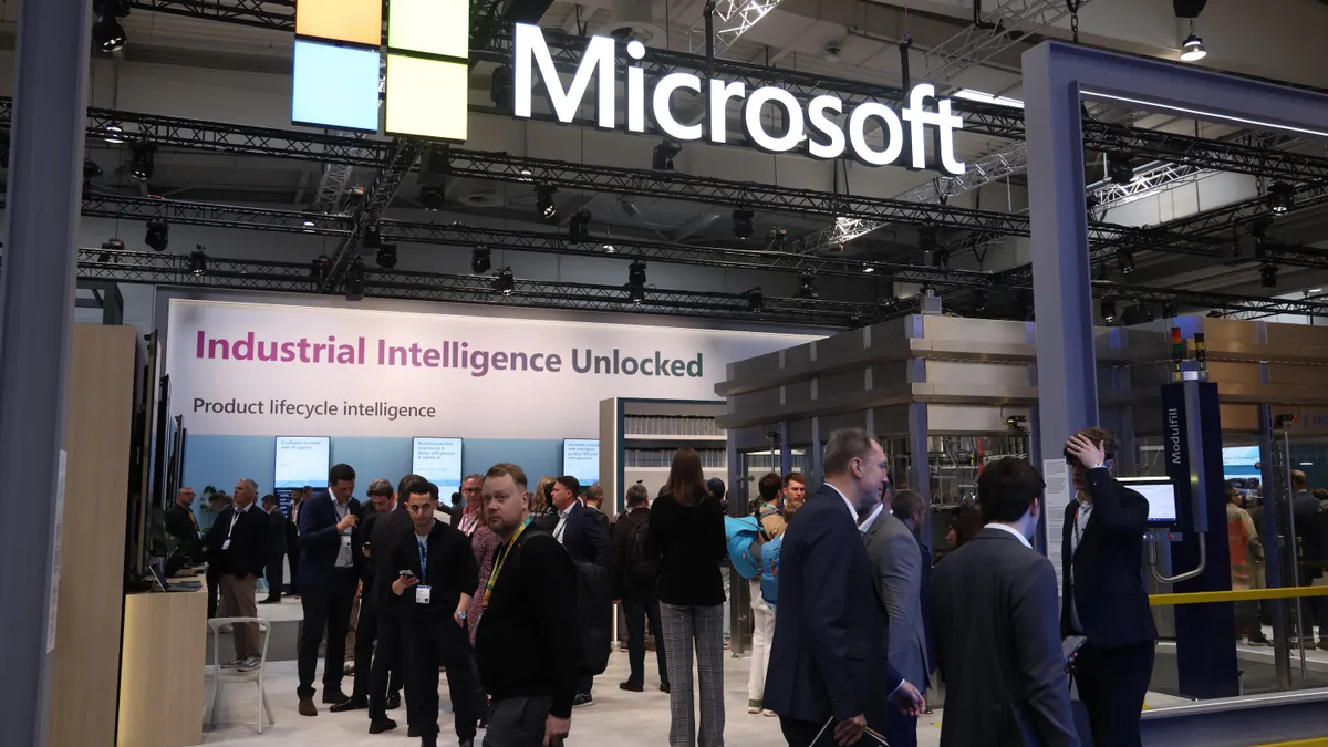 Visitors crowd the Microsoft exhibition stand at the 2026 Hannover Messe industrial trade fair on April 20, 2026 in Hanover, Germany. This