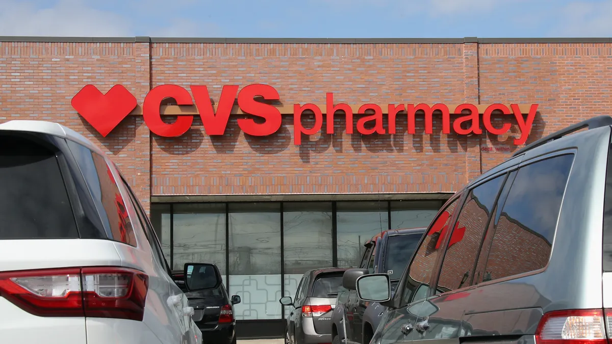 A picture of the exterior of a CVS Pharmacy with the logo and name in view.