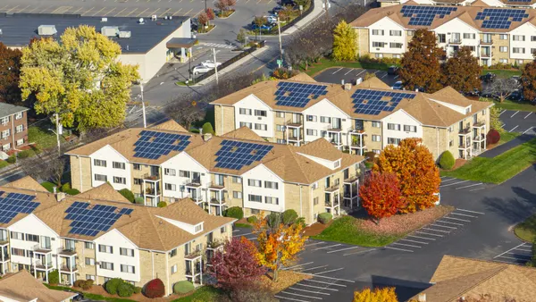 Rooftop solar panels at an apartment complex.