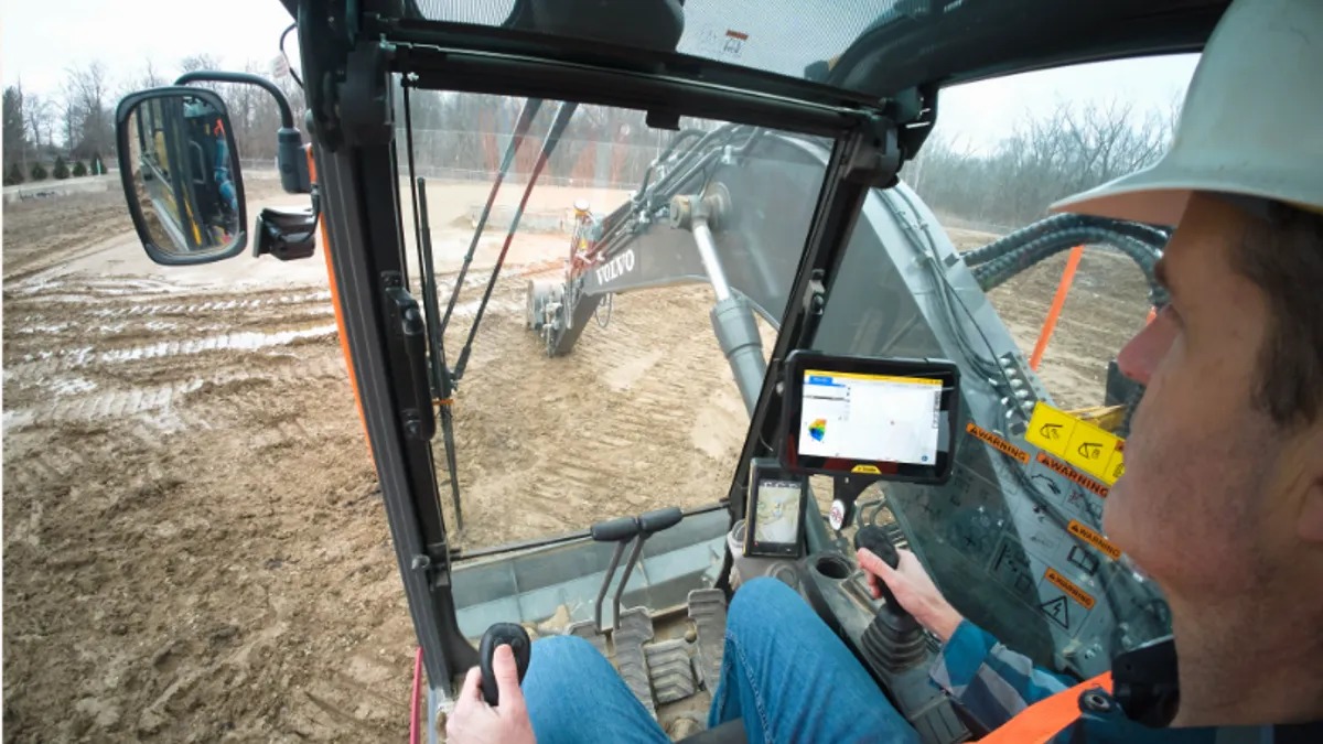 A shot of a worker using a Trimble product