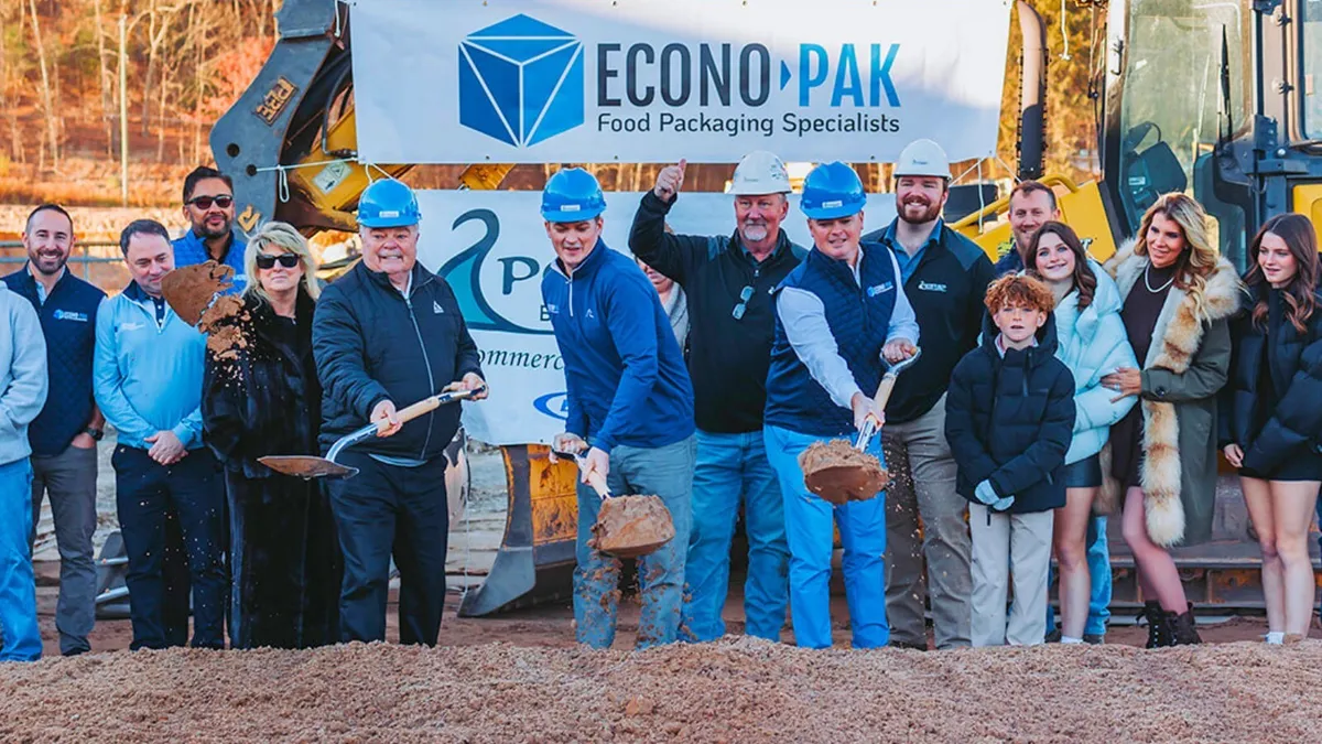 Paul Wiebel Sr., Bob Wiebel, and Paul Wiebel Jr. shovel dirt on the Milford, Pennsylvania, site of an Econo-Pak facility expansion ceremony.