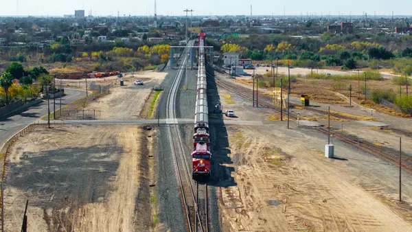 A freight train crosses the U.S.-Mexico border.