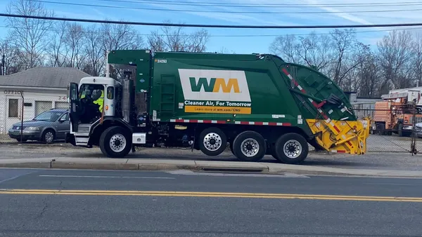 A trash truck on a residential street