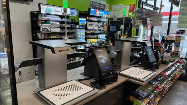 A photo of a Mashgin self checkout machine inside a store.