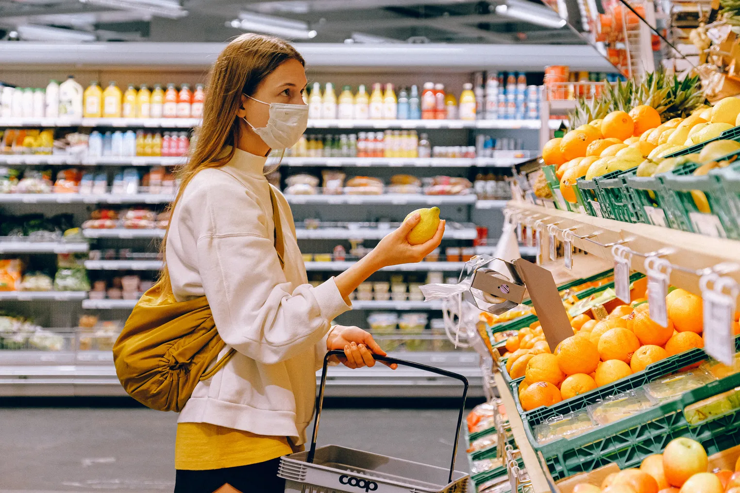 Stock photo of a masked grocery shopper