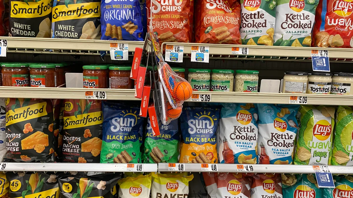 Snacking brands made by PepsiCo's Frito-Lay division on a grocery store shelf in Washington, D.C.