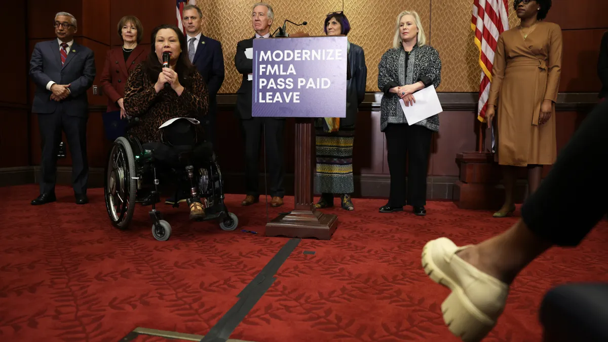 U.S. Sen. Tammy Duckworth (D-IL) speaks as (L-R) Rep. Bobby Scott (D-VA), Sen. Tina Smith (D-MN), Rep. Sean Casten (D-IL), Rep. Richard Neal (D-MA), Rep. Rosa DeLauro (D-CT), Sen. Kirsten Gillibrand