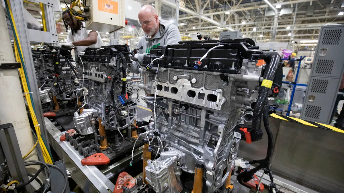 A worker assembling engines at the Stellantis Dundee Engine Complex in Michigan.