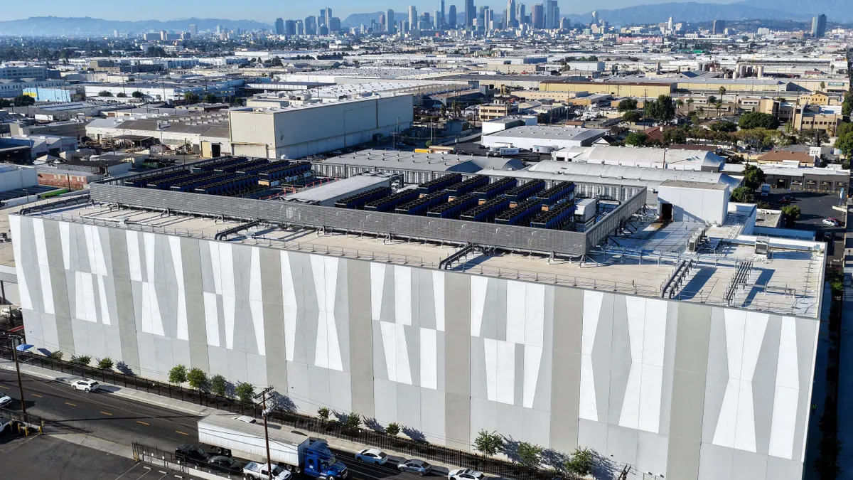 An aerial view of a 33-MW data center with a city in the background.