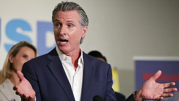 Up close shot of Gavin Newsom while speaking at an event.