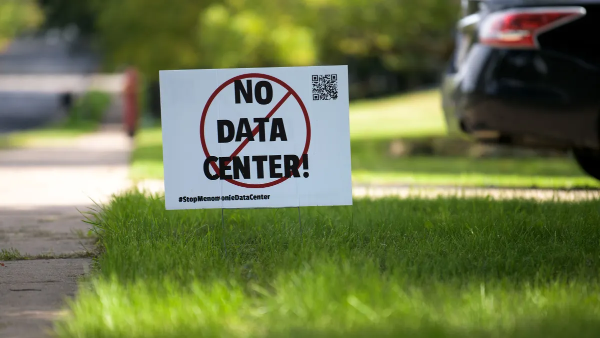 A sign on a lawn reading "No data center!"